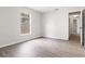 Bedroom view highlighting a window, flooring, and access to the hallway at 3143 Grayton Dr, Spring Hill, FL 34609
