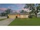 Charming single-story home features a well-maintained lawn and cozy facade, perfect for relaxed living at 3143 Grayton Dr, Spring Hill, FL 34609