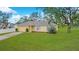 Charming single-story home with a well-kept front lawn and inviting curb appeal at 3143 Grayton Dr, Spring Hill, FL 34609
