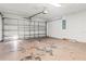 Spacious garage with a working garage door, ready for vehicles and storage at 3143 Grayton Dr, Spring Hill, FL 34609