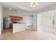 Bright kitchen features stainless steel appliances, light countertops and wood cabinetry at 3143 Grayton Dr, Spring Hill, FL 34609