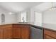 Kitchen boasts granite counters, stainless dishwasher, and open layout ideal for modern cooking and entertaining at 3143 Grayton Dr, Spring Hill, FL 34609