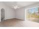 Living room features wood floors, vaulted ceilings, and sliding door access to backyard at 3143 Grayton Dr, Spring Hill, FL 34609