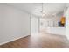 Bright living area with wood floors, vaulted ceilings, and sliding door access to outside at 3143 Grayton Dr, Spring Hill, FL 34609