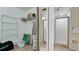 Bathroom showing a storage closet area along with the shower behind a glass enclosure at 4655 46Th Street Ct # 101, Bradenton, FL 34210