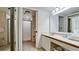 Well-lit bathroom features a glass-enclosed shower, a sink with a mirror, and ample counter space at 4655 46Th Street Ct # 101, Bradenton, FL 34210