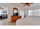 Bright bedroom boasts tiled floors, ceiling fan, and a large window for lots of natural light at 4655 46Th Street Ct # 101, Bradenton, FL 34210