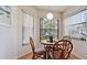 Charming breakfast nook with a round table and comfortable seating, bathed in natural light from the windows at 4655 46Th Street Ct # 101, Bradenton, FL 34210
