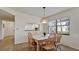 Well-lit dining area featuring a wooden table set and a pass-through view to the kitchen at 4655 46Th Street Ct # 101, Bradenton, FL 34210