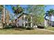 Exterior view of a two-story condo building with lush landscaping at 4655 46Th Street Ct # 101, Bradenton, FL 34210