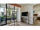 Inviting living room with a screened patio featuring an outdoor dining set for enjoying serene views at 4655 46Th Street Ct # 101, Bradenton, FL 34210