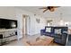 Relaxing living room with a TV, comfortable seating, and convenient access to other areas of the home at 4655 46Th Street Ct # 101, Bradenton, FL 34210