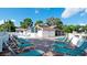 A beautiful in-ground community pool with several lounge chairs to relax and unwind at this property at 4655 46Th Street Ct # 101, Bradenton, FL 34210