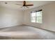Bright bedroom with ceiling fan and large window at 8809 49Th E Ave, Palmetto, FL 34221