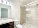 Bathroom with vanity, toilet, and a large glass shower at 8809 49Th E Ave, Palmetto, FL 34221