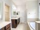 Main bath with soaking tub and double vanity at 8809 49Th E Ave, Palmetto, FL 34221