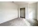 Bright bedroom with neutral walls, carpet, and a double door closet at 8809 49Th E Ave, Palmetto, FL 34221