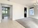 Bright dining room with tile and carpeted floors, and views into the living room at 8809 49Th E Ave, Palmetto, FL 34221