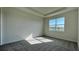 Bright bedroom with large window and carpeted floor at 9149 Gulf Haven Dr, Parrish, FL 34219