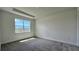 Bright bedroom with neutral carpeting and a large window offering natural light at 9137 Gulf Haven Dr, Parrish, FL 34219
