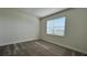 Bright bedroom with neutral walls and gray carpeting at 9141 Gulf Haven Dr, Parrish, FL 34219