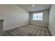 Upstairs bedroom with neutral walls and gray carpeting at 9141 Gulf Haven Dr, Parrish, FL 34219