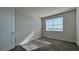 Well-lit bedroom featuring a window with blinds and carpeted floor at 9141 Gulf Haven Dr, Parrish, FL 34219