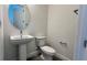 Clean bathroom with pedestal sink and oval mirror at 9141 Gulf Haven Dr, Parrish, FL 34219