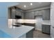 Modern kitchen with gray cabinets and white quartz countertops at 9141 Gulf Haven Dr, Parrish, FL 34219