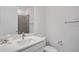 Modern bathroom with white vanity, gray tile, and a single sink at 9136 Gulf Haven Dr, Parrish, FL 34219