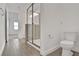 Bathroom with toilet and shower, near another bedroom at 9136 Gulf Haven Dr, Parrish, FL 34219