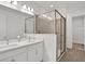 Modern bathroom with double vanity and glass shower at 9136 Gulf Haven Dr, Parrish, FL 34219