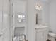 Clean bathroom with white vanity and gray tile flooring at 9136 Gulf Haven Dr, Parrish, FL 34219