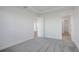 Light and airy bedroom with gray carpet and access to bathroom and other rooms at 9136 Gulf Haven Dr, Parrish, FL 34219