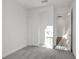 Bright bedroom with gray carpet and a walk-in closet at 9136 Gulf Haven Dr, Parrish, FL 34219