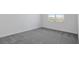 Bright bedroom with gray carpet and a view at 9136 Gulf Haven Dr, Parrish, FL 34219