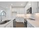 Modern kitchen with white cabinets and stainless steel appliances at 9136 Gulf Haven Dr, Parrish, FL 34219