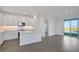Modern kitchen with white cabinets, quartz countertops, and stainless steel appliances at 9136 Gulf Haven Dr, Parrish, FL 34219