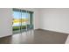 Living area with view of lake from sliding glass doors at 9136 Gulf Haven Dr, Parrish, FL 34219