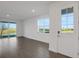 Bright living room with tile floors and sliding glass doors at 9136 Gulf Haven Dr, Parrish, FL 34219
