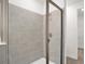 Clean shower with gray tile and glass enclosure at 9136 Gulf Haven Dr, Parrish, FL 34219