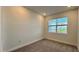 Spacious bedroom with neutral walls, carpeting and a window with blinds at 9105 Gulf Haven Dr, Parrish, FL 34219