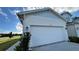 Two-car garage with white door at 9105 Gulf Haven Dr, Parrish, FL 34219