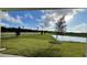 View of backyard with pond and lush landscaping at 9105 Gulf Haven Dr, Parrish, FL 34219