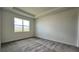 Spacious bedroom with gray carpeting and large window at 9148 Gulf Haven Dr, Parrish, FL 34219