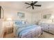 Light and airy bedroom with a queen bed and white dresser at 254 Rotonda E Blvd, Rotonda West, FL 33947