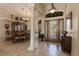 Formal dining room with wood table and chairs, and a large window at 254 Rotonda E Blvd, Rotonda West, FL 33947