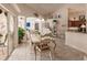 Bright dining room with glass-top table and seating for six at 254 Rotonda E Blvd, Rotonda West, FL 33947