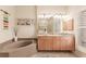Double vanity bathroom with a large soaking tub and updated fixtures at 254 Rotonda E Blvd, Rotonda West, FL 33947
