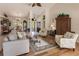 Living room with hardwood floors, comfortable seating, and large windows at 254 Rotonda E Blvd, Rotonda West, FL 33947